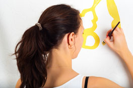 lady painting on wall